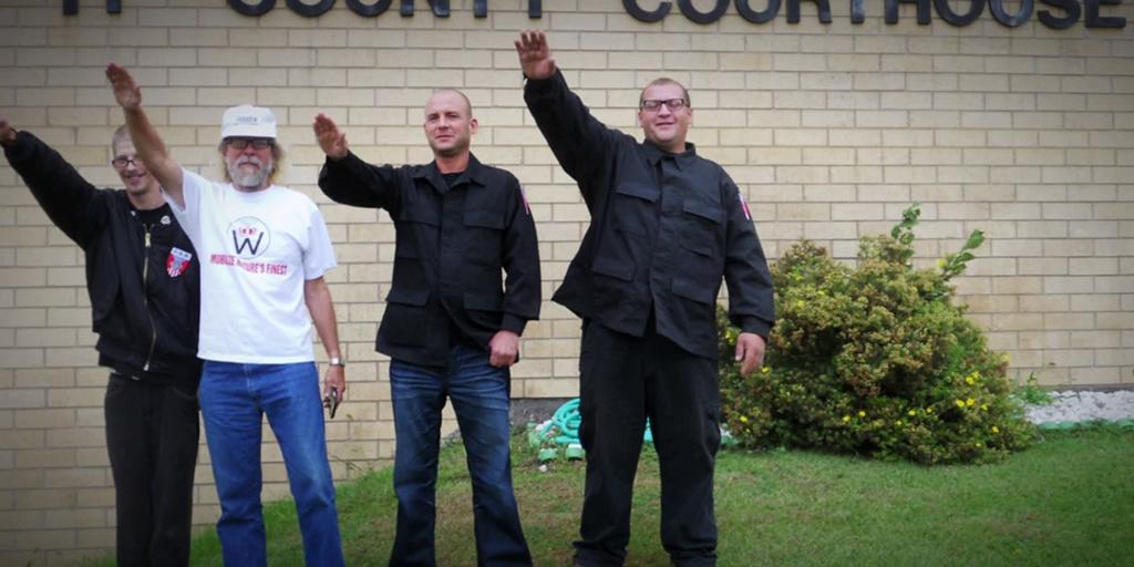 Craig Cobbs and his fellow  fellow partisans  doing a nazi salute. Photo.