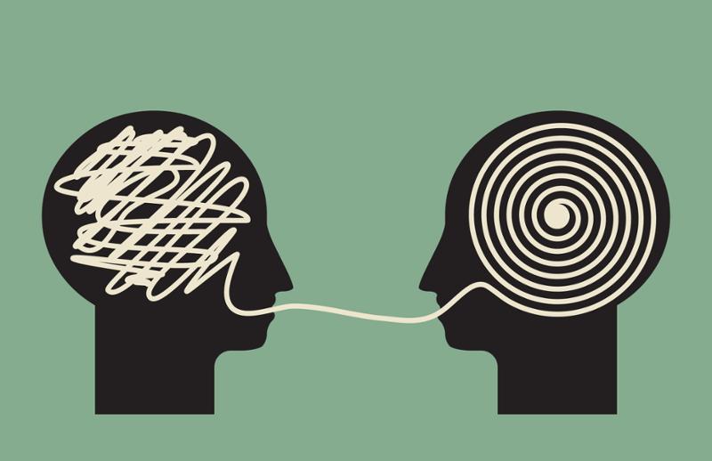 Illustrasjon av to hoder som dekoder informasjon.