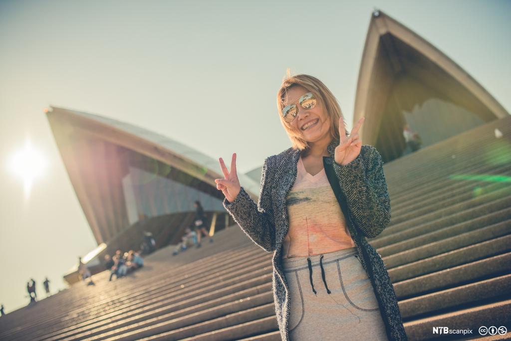 Tourist in front of the Sydney Opera House