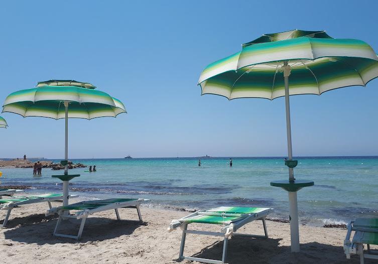 Beach chairs and parasols, sandy beach, Alghero, Sardinia