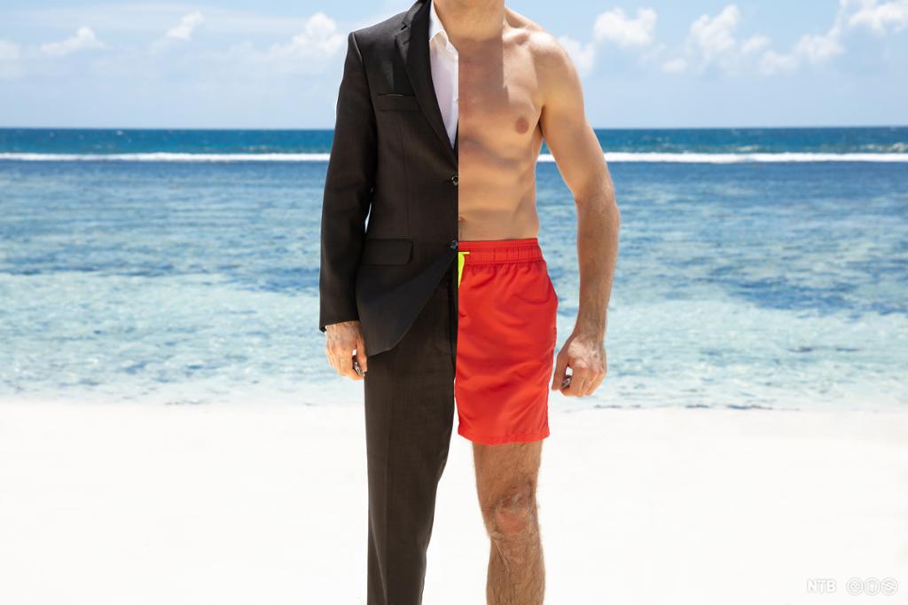 A man on a beach half dressed in swimwear and half in a formal suit. Photo. 