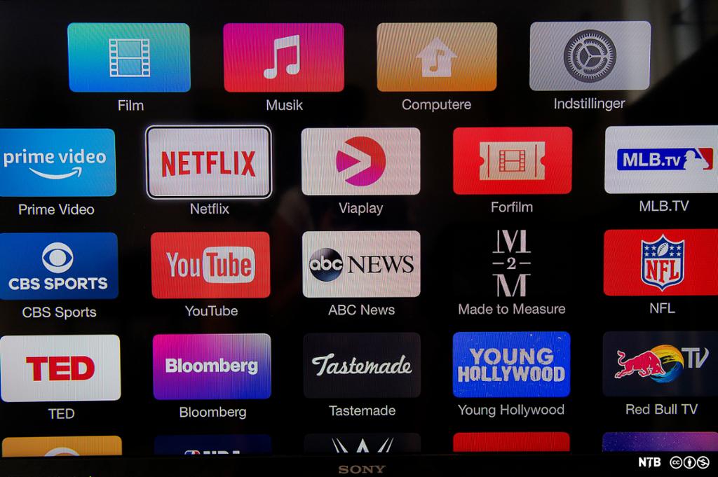 På ein TV-skjerm ser vi appikon for ulike strøymetenester, blant anna Netflix, Viaplay og YouTube. Foto.