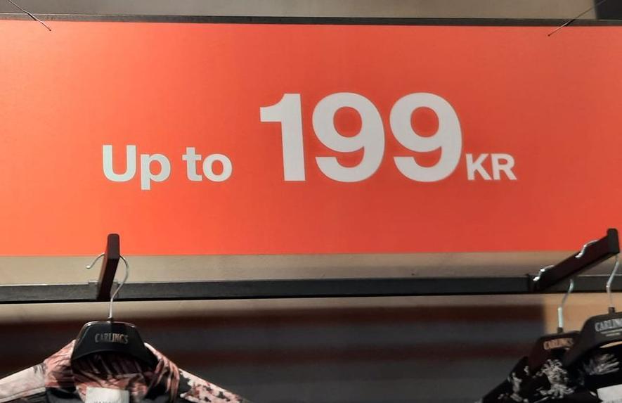 A photo of an advertisement poster from a fashion store which is partly in Norwegian and partly in English.