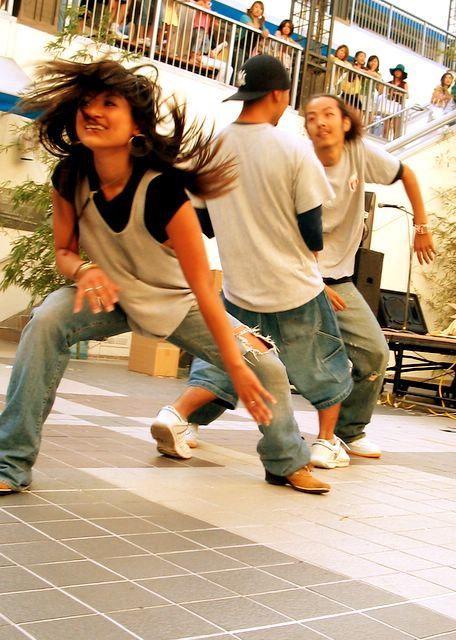 Young people dancing in the street.