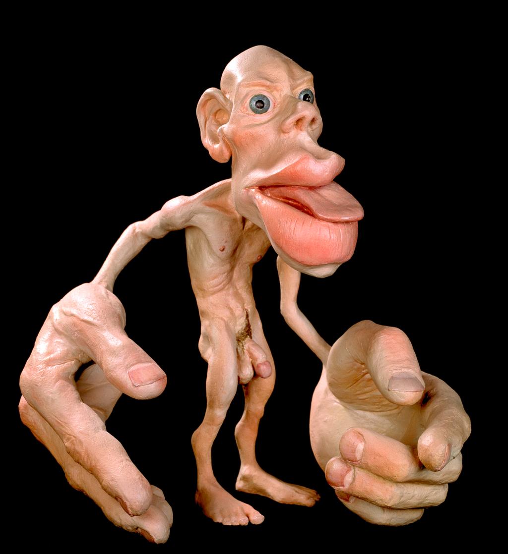 Modell av ein mann med ekstra stor(e) lepper, tunge og hender