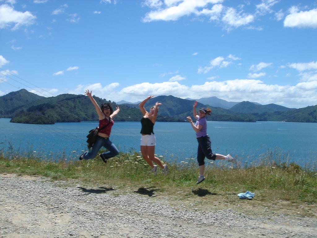 Three women jumping in the air. Photo.