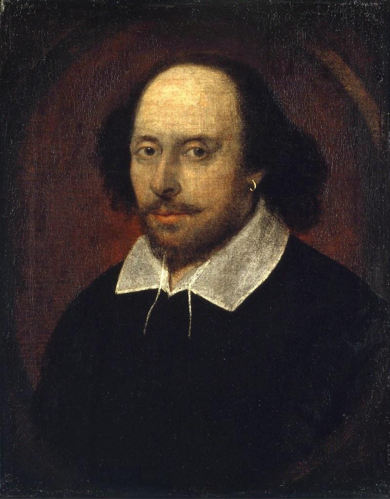 A portrait of William Shakespeare. He's wearing a white shirt and a black coat. He looks directly at the painter with a serious look.  Painting.
