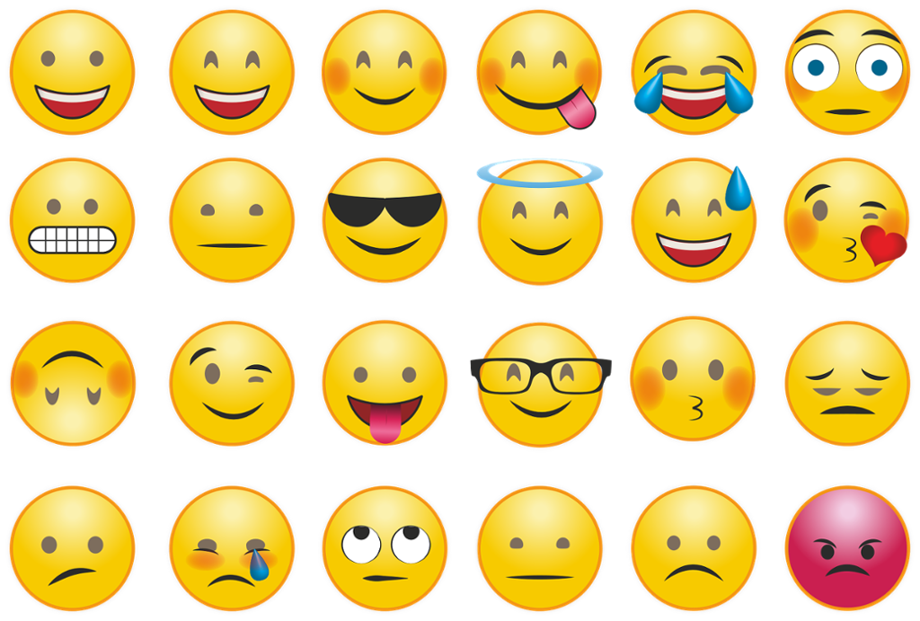 Sett med 24 forskjellige emojier oppstilt på rekke og rad. Illustrasjon.