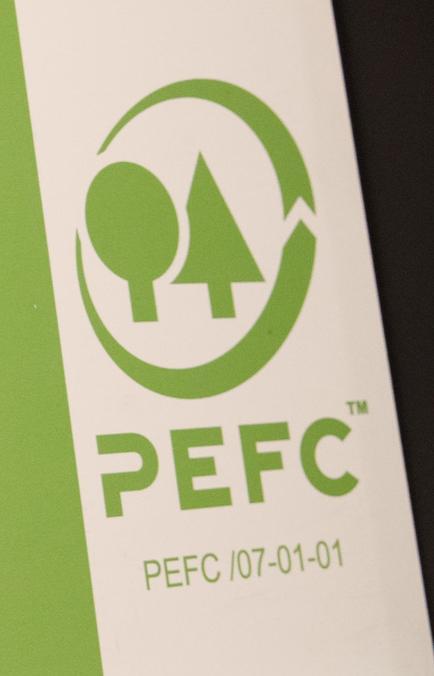 PEFC-logo som viser to trær med en sirkel rundt. Foto.