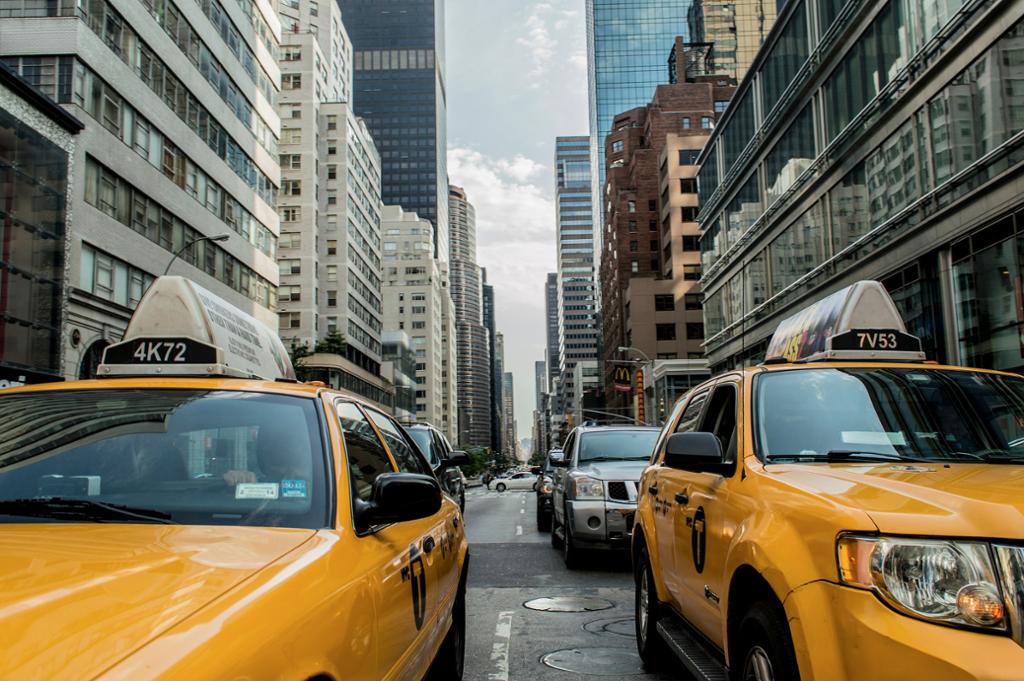 Two yellow  taxicabs in New York. Photo.