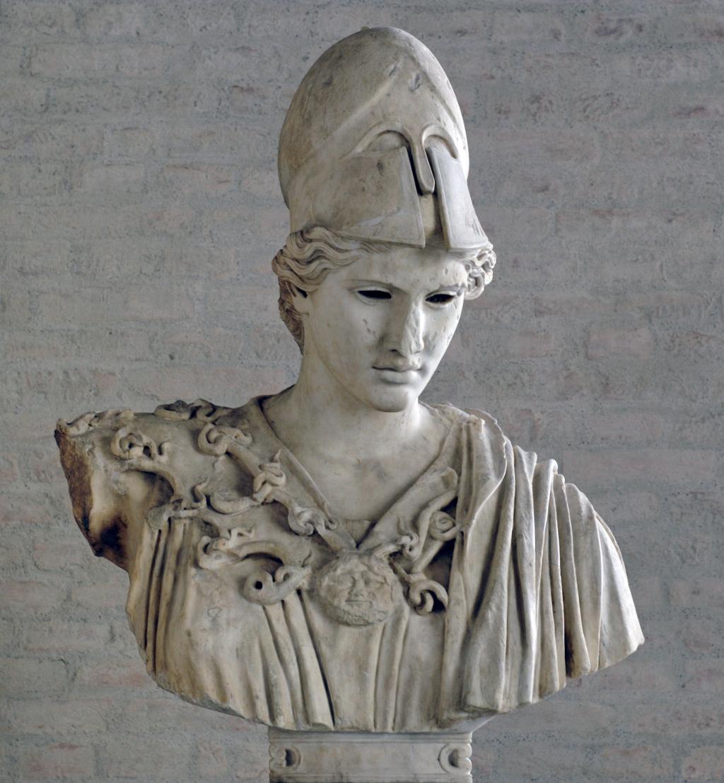 Sculpture: Marble bust showing a woman wearing a helmet. Her clothes are draped, and she wears a large necklace. 