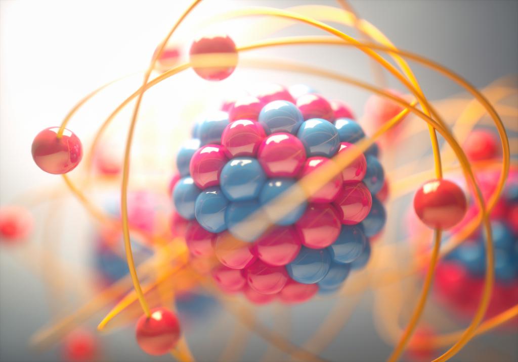 Modell at et atom med der kjernen er bygget opp av kuler som er pakket sammen. Andre kuler beveger seg i baner rundt kjernen, disse forestiller elektroner. Illustrasjon.