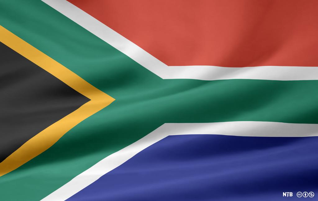 Flag of South Africa. The colours are black, yellow, green, white, blue, and red. Photo.