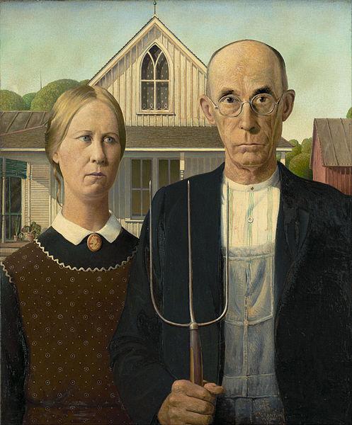 Painting: We see a man and a woman standing in front of a white house. There is a red barn to the left. Their faces look serious.  The man is holding a pitchfork. The woman is wearing a black dress, with a white collar. She wears a cameo brooch and an apron. The man is wearing dungarees, a striped shirt, a dark suit jacket. He wears glasses. 