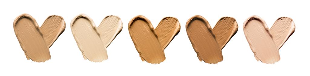 Foundation smears palette close-up. Heart shaped make-up smudges in different shades. Illustration.