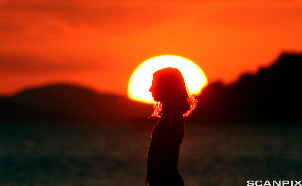 Profile of girl in the sunset