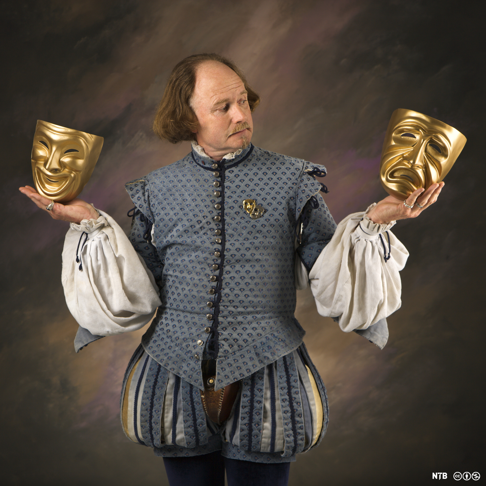 Shakespeare with theatrical masks.