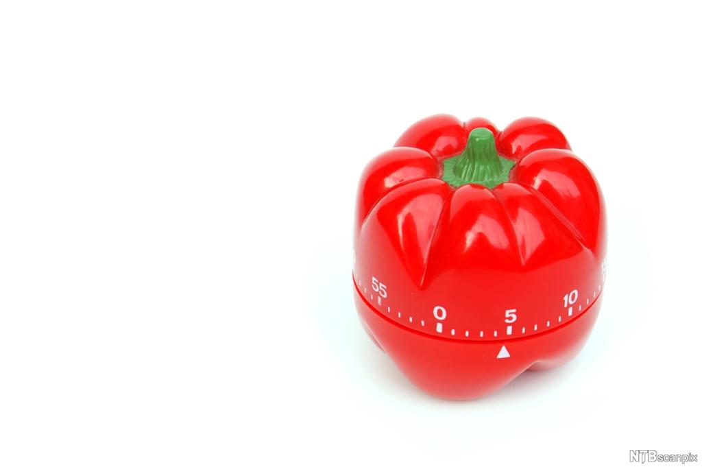 En eggeklokke i form av en tomat. Foto.