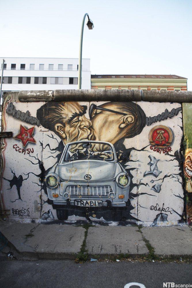 Brezhnev and Honecker on the Berlin Wall. In front an East German Trabant