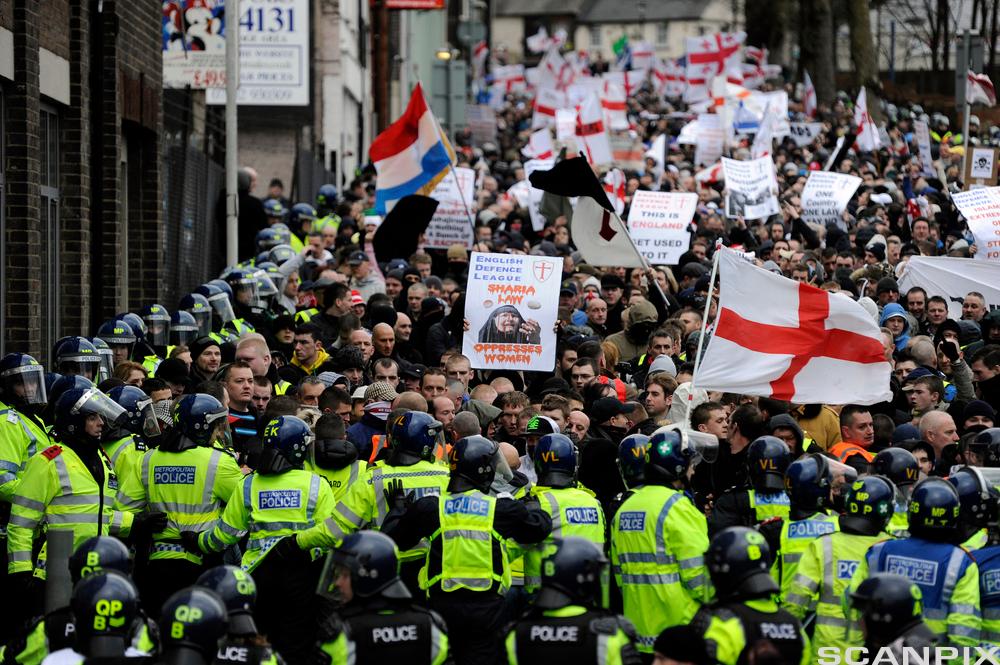 People and police on the street. Photo.