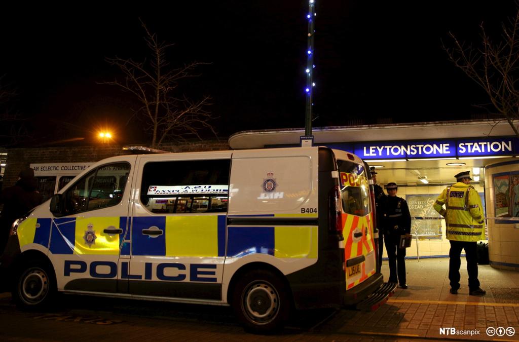 Police officers investigate a crime scene at Leytonstone underground station in east London