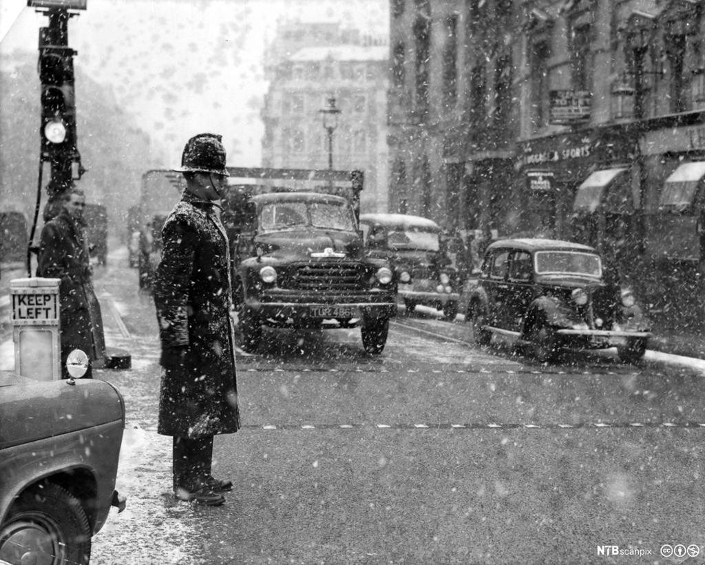 Police officer in snowy London