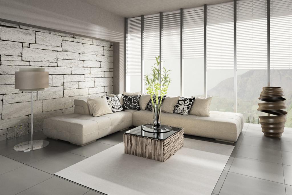 Moderne stueinteriør i hvitt og grått med store vinduer. Foto.