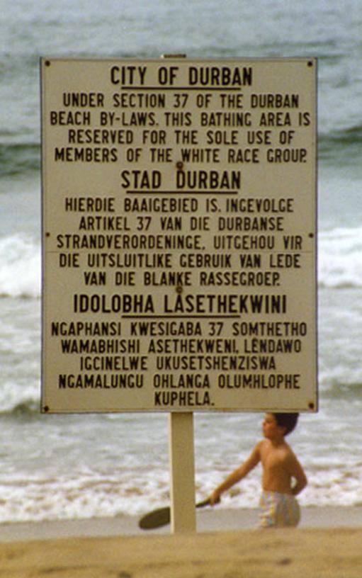 Sign in Durban that states the beach is for whites only under section 37 of the Durban beach by-laws. The languages are English, Afrikaans and Zulu, the language of the black population group in the Durban area.